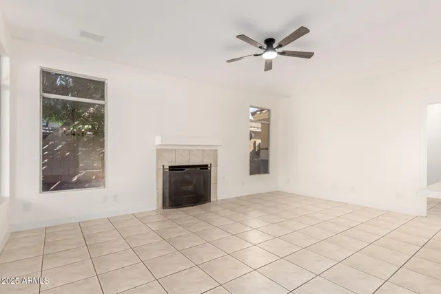 a view of an empty room with a fireplace