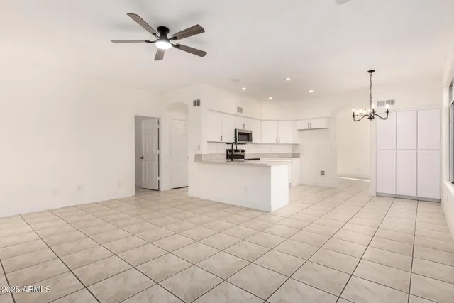 a view of a kitchen with electric appliances