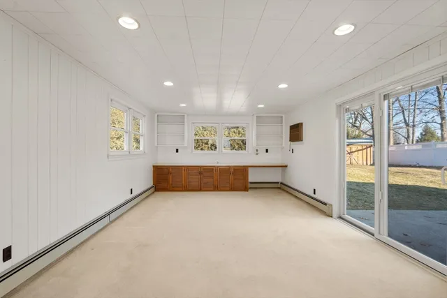 a view of room with window and ceiling fan