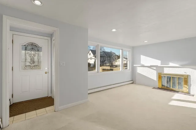 an empty room with windows and closet