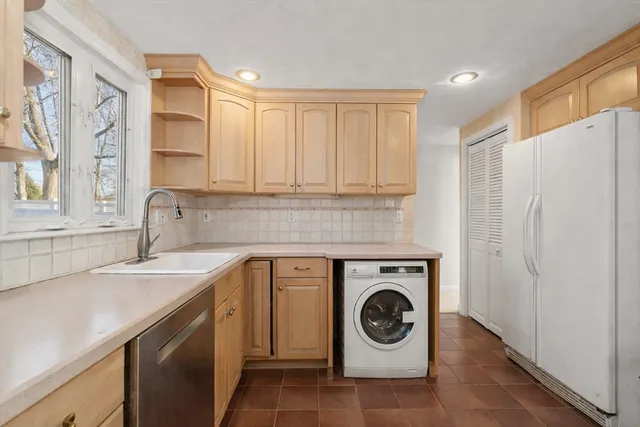 a utility room with sink washer and dryer