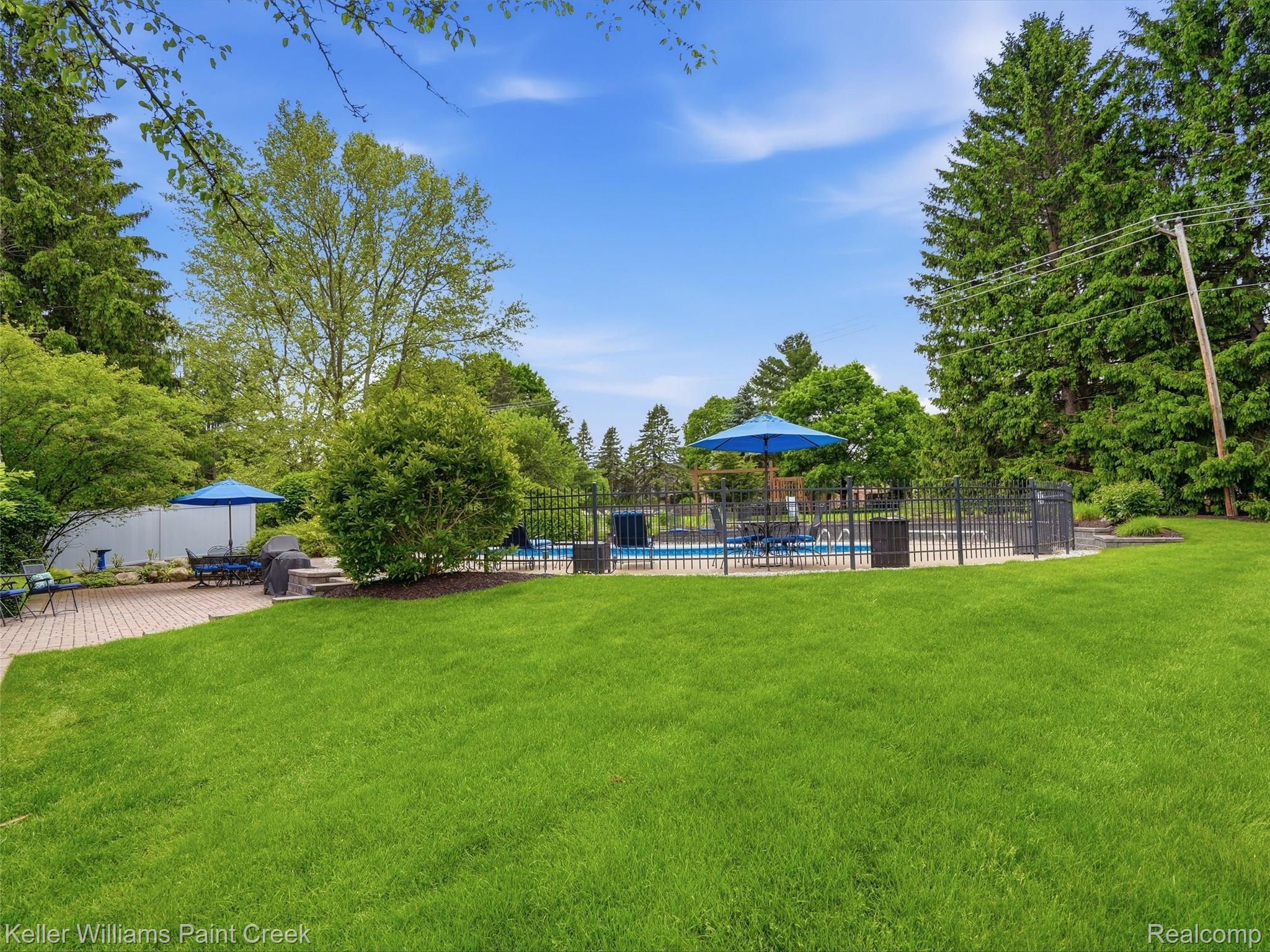 1351 West Fairview Lane Rochester, MI 48306 - Photo 63 of 65 View of yard with a patio and view of scattered trees
