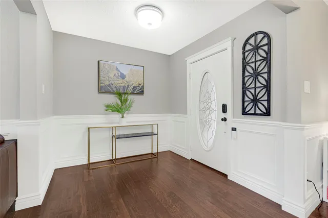 a view of a room with wooden floor and window