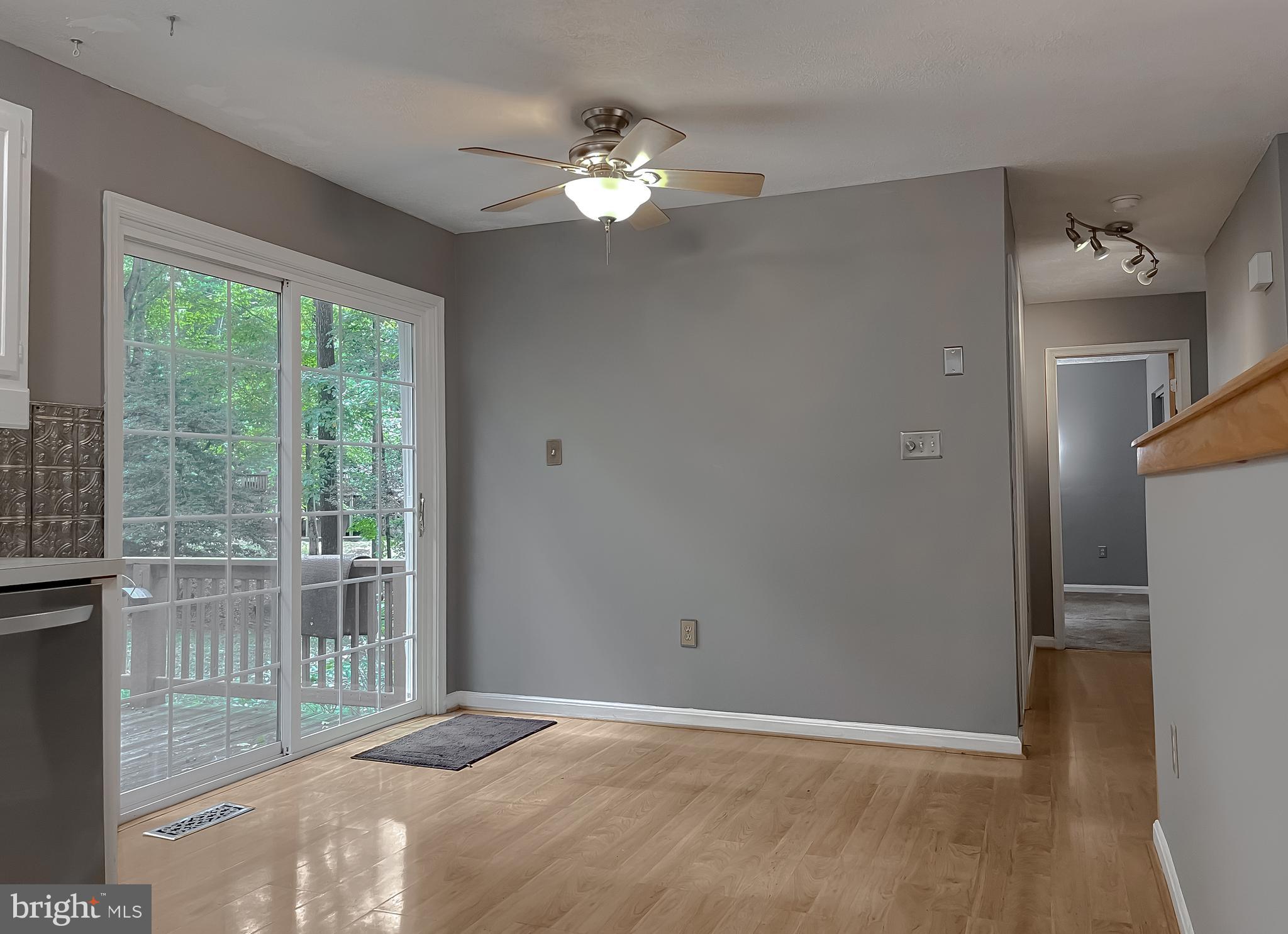 720 Willow Road Lusby, MD 20657 - Photo 12 of 43 dining area and deck access