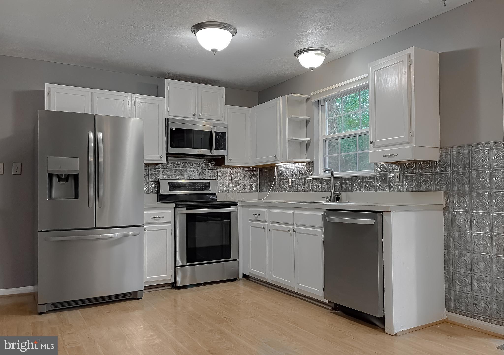 720 Willow Road Lusby, MD 20657 - Photo 3 of 43 kitchen with stainless steel appliances