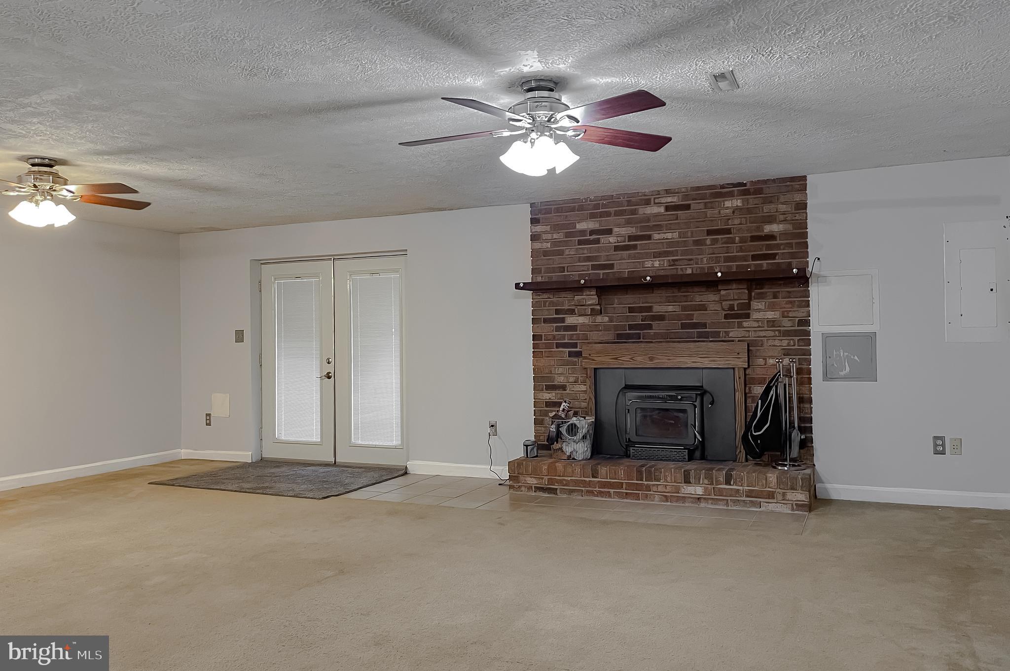 720 Willow Road Lusby, MD 20657 - Photo 5 of 43 humungous family room w/ woodstove insert