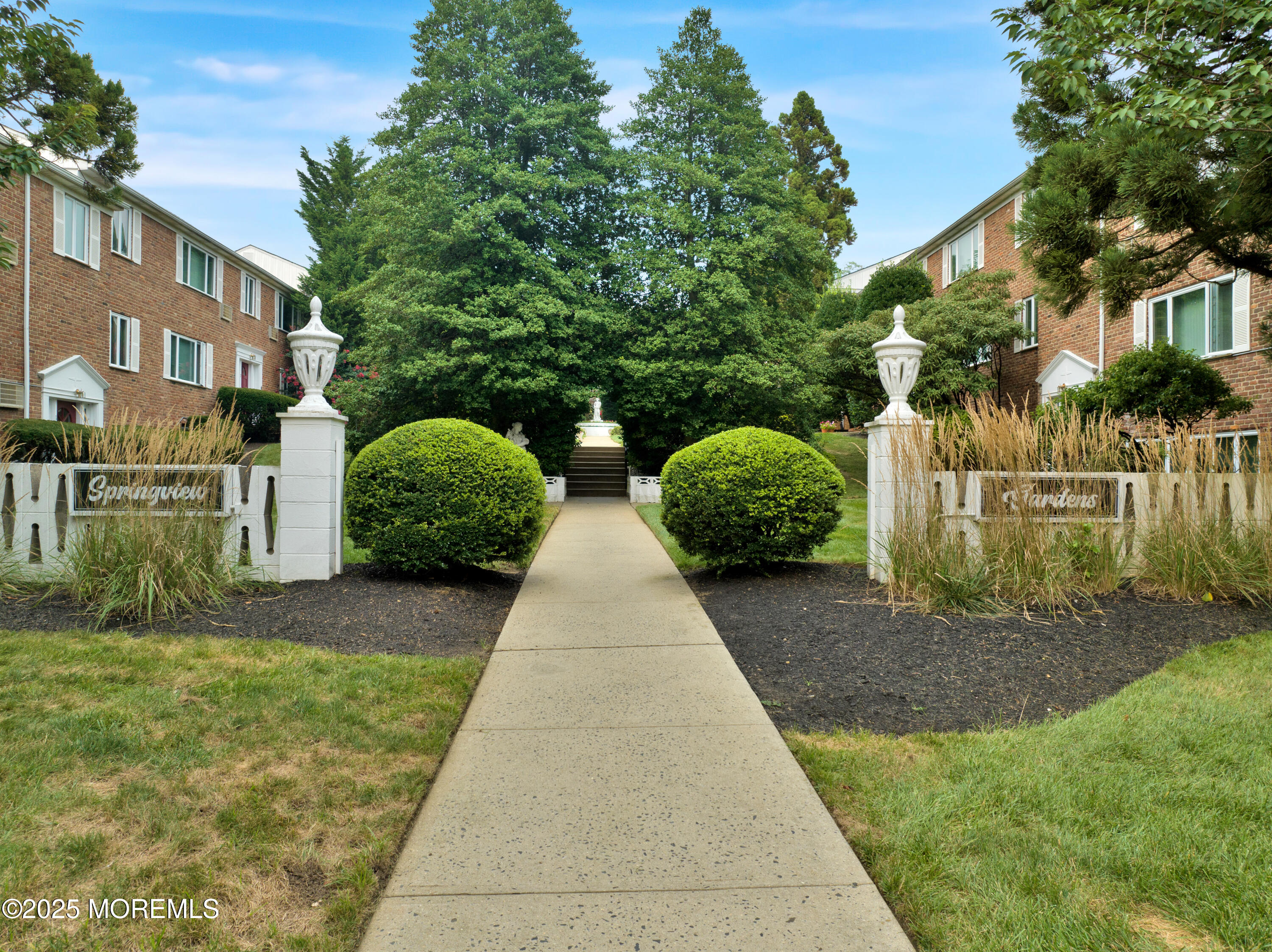 283 Spring Street, Unit 3A Red Bank, NJ 07701 - Photo 19 of 20 a view of a brick house with a yard