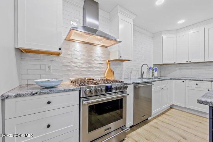 283 Spring Street, Unit 3A Red Bank, NJ 07701 - Photo 2 of 20 a kitchen with granite countertop cabinets stainless steel appliances and wooden floor