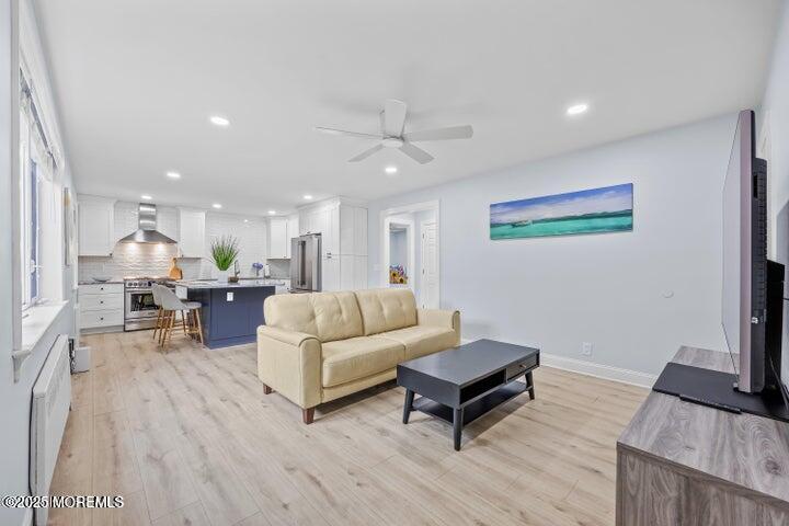 283 Spring Street, Unit 3A Red Bank, NJ 07701 - Photo 7 of 20 a living room with furniture and a flat screen tv