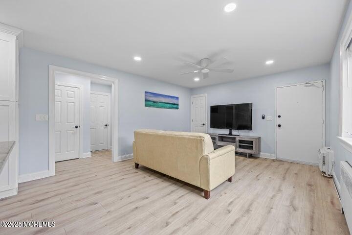283 Spring Street, Unit 3A Red Bank, NJ 07701 - Photo 8 of 20 a living room with furniture and a flat screen tv
