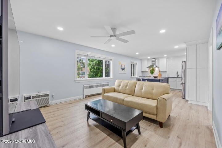 283 Spring Street, Unit 3A Red Bank, NJ 07701 - Photo 10 of 20 a living room with furniture and a wooden floor