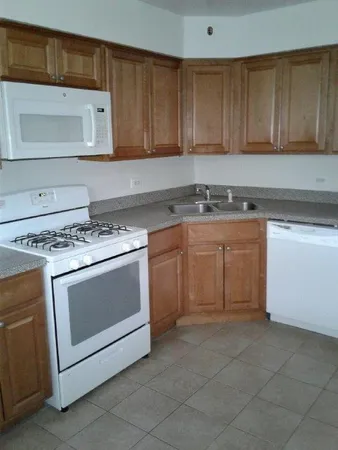 a kitchen with a stove and a sink