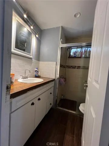 a bedroom with a bed and a tv