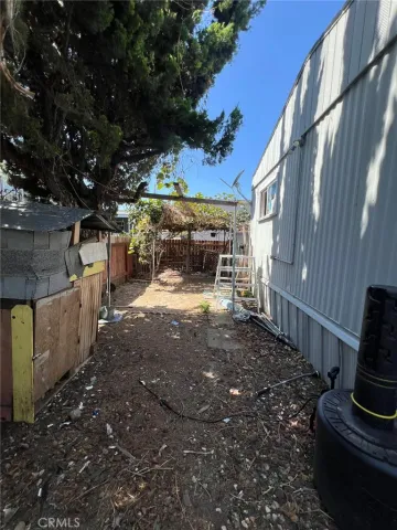 a view of a backyard with sitting area