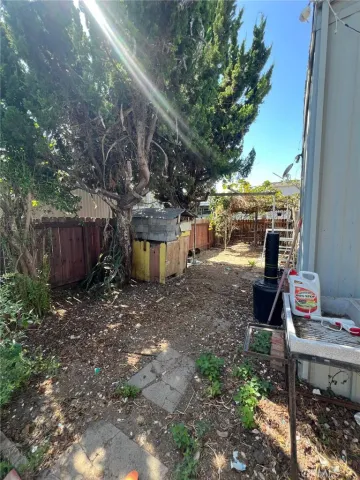 a view of a backyard with sitting area