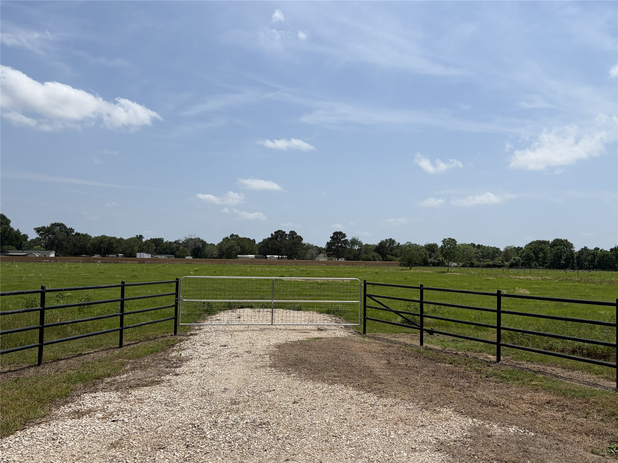38715 Wiggins Road Hempstead, TX 77445 - Photo 8 of 8 a view of a lake with a mountain in the background