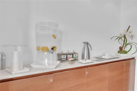 a kitchen with a refrigerator and window