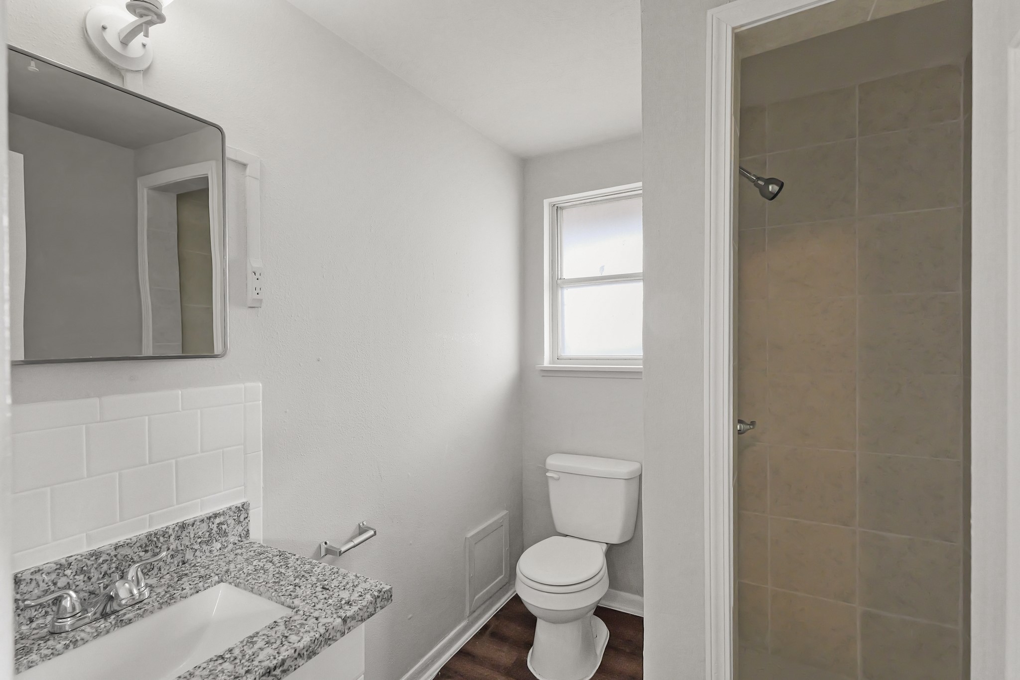 414 Grantham Road Baytown, TX 77521 - Photo 15 of 19 a bathroom with a toilet a sink and mirror