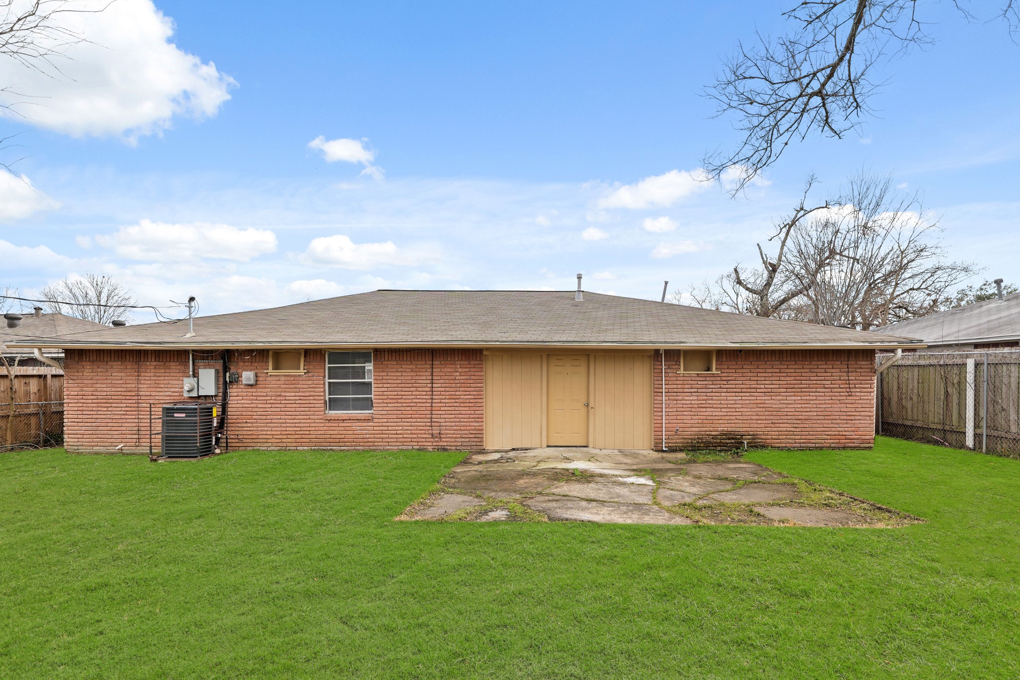 414 Grantham Road Baytown, TX 77521 - Photo 17 of 19 a front view of a house with a garden and yard