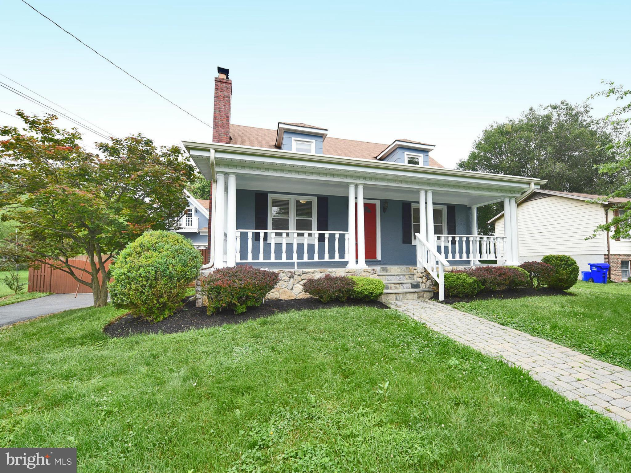 2138 Spencerville Road Spencerville, MD 20868 - Photo 2 of 30 a front view of a house with a garden and plants