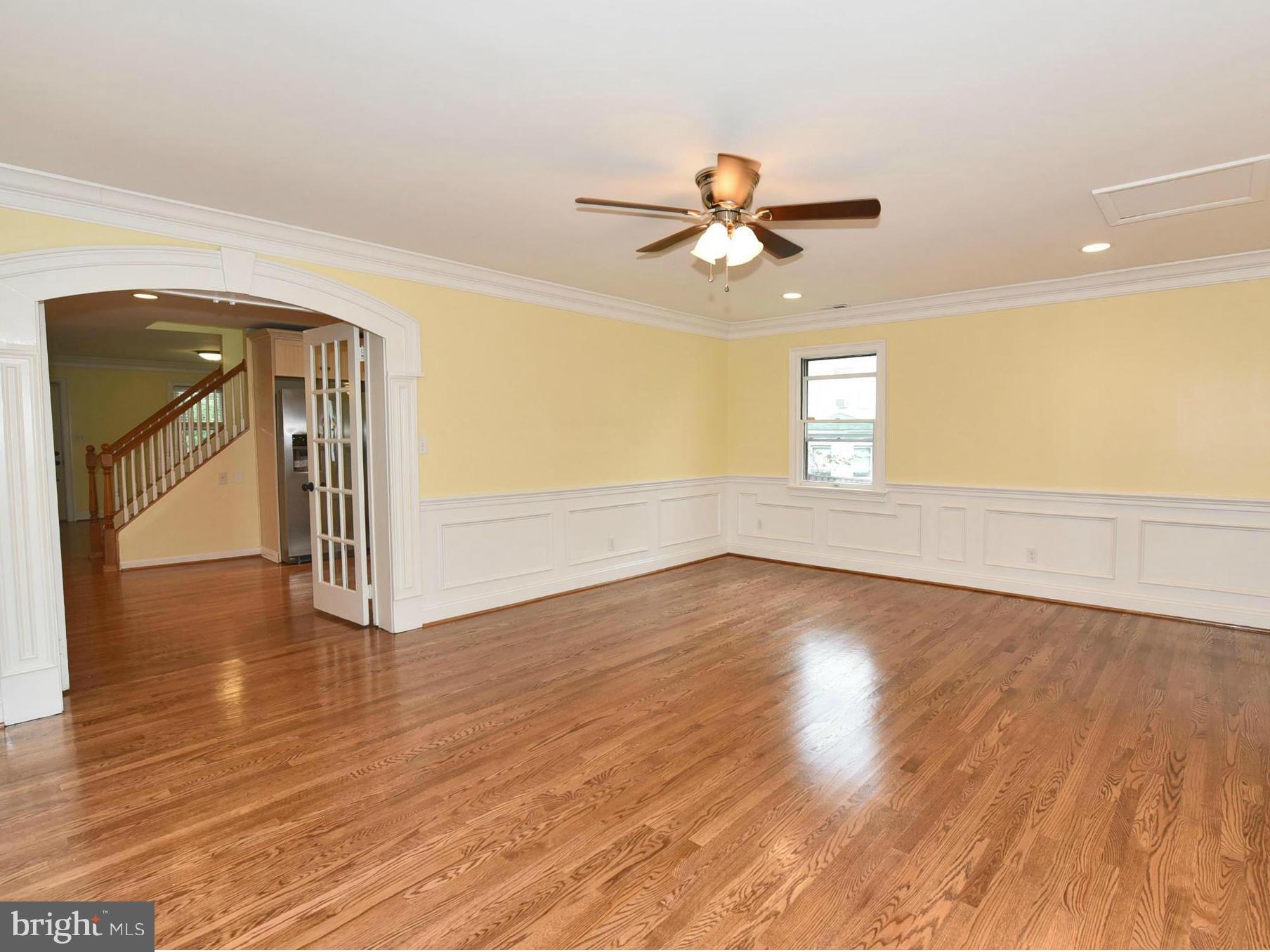 2138 Spencerville Road Spencerville, MD 20868 - Photo 11 of 30 a view of empty room with wooden floor and fan