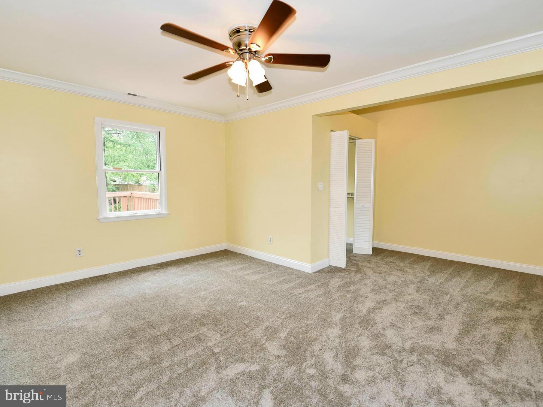 2138 Spencerville Road Spencerville, MD 20868 - Photo 13 of 30 an empty room with a window and a fan