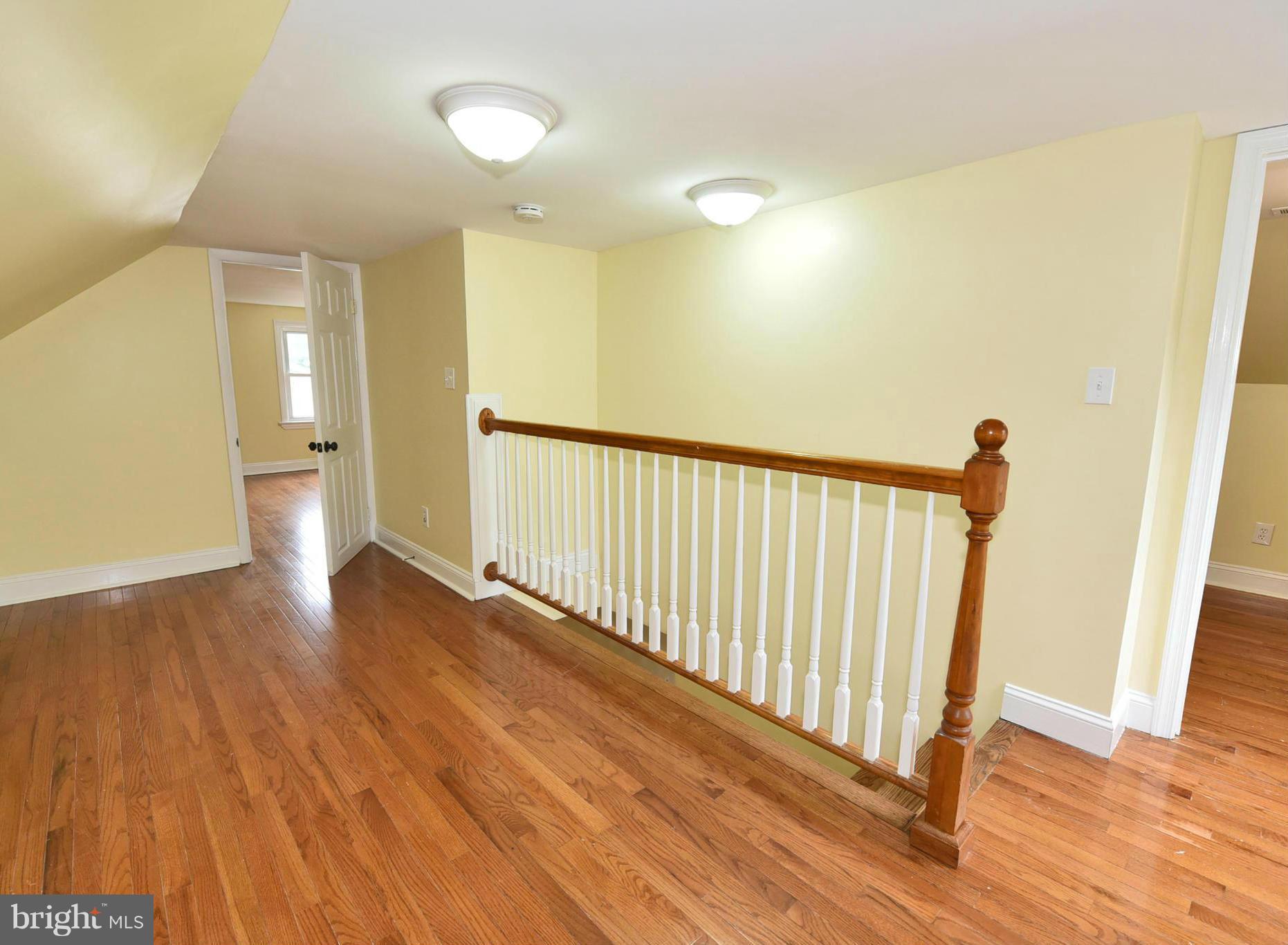 2138 Spencerville Road Spencerville, MD 20868 - Photo 17 of 30 a view of a hallway with wooden floor