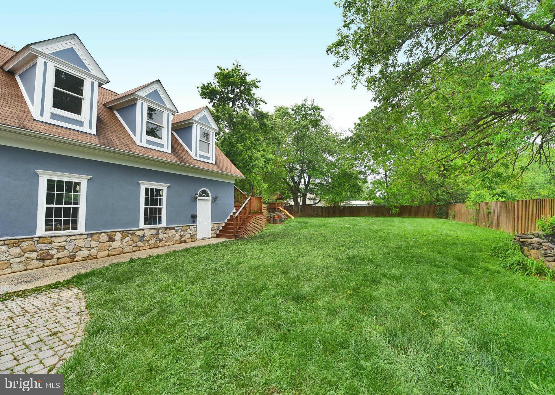 2138 Spencerville Road Spencerville, MD 20868 - Photo 26 of 30 a front view of a house with a garden