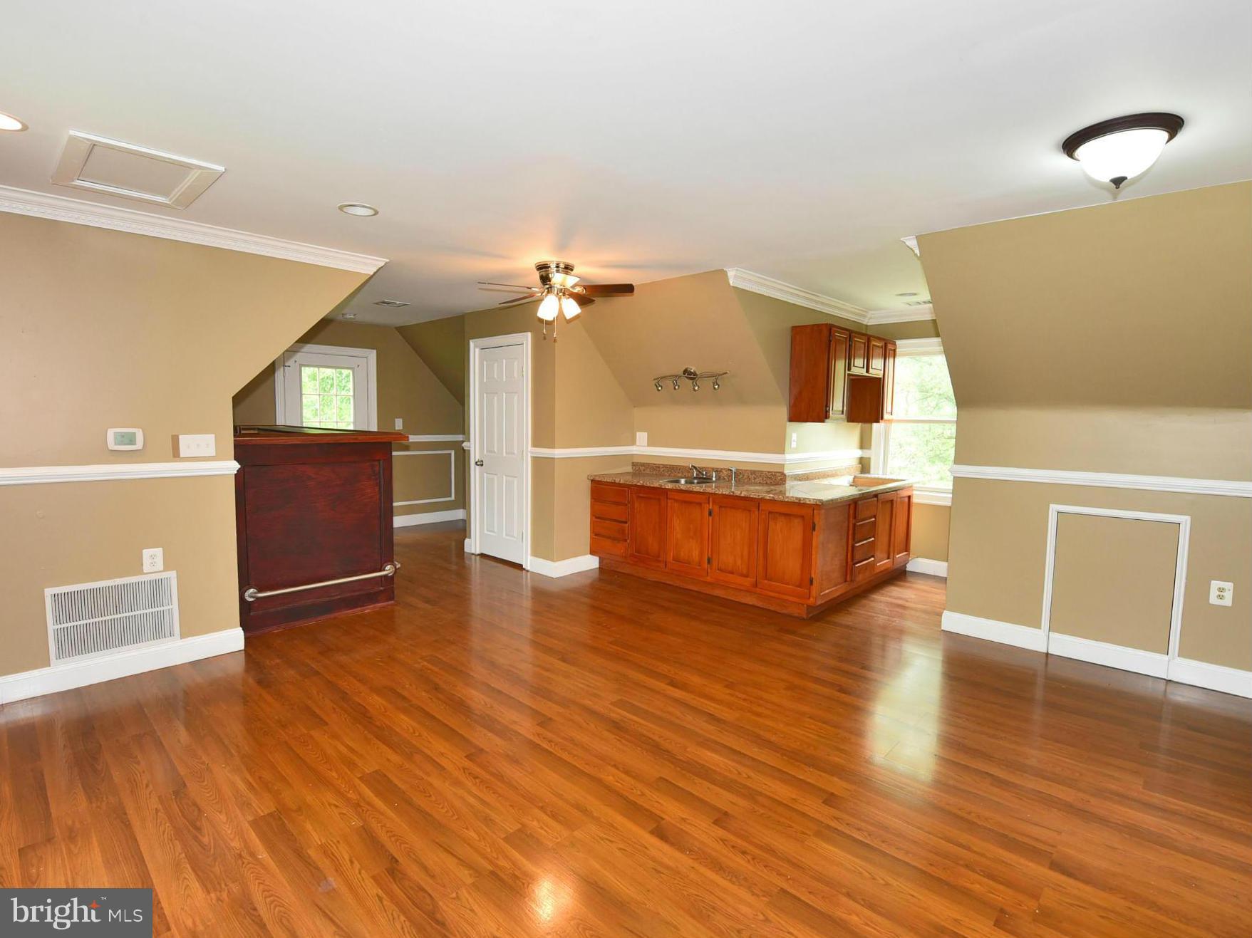 2138 Spencerville Road Spencerville, MD 20868 - Photo 28 of 30 a living room with furniture and a wooden floor