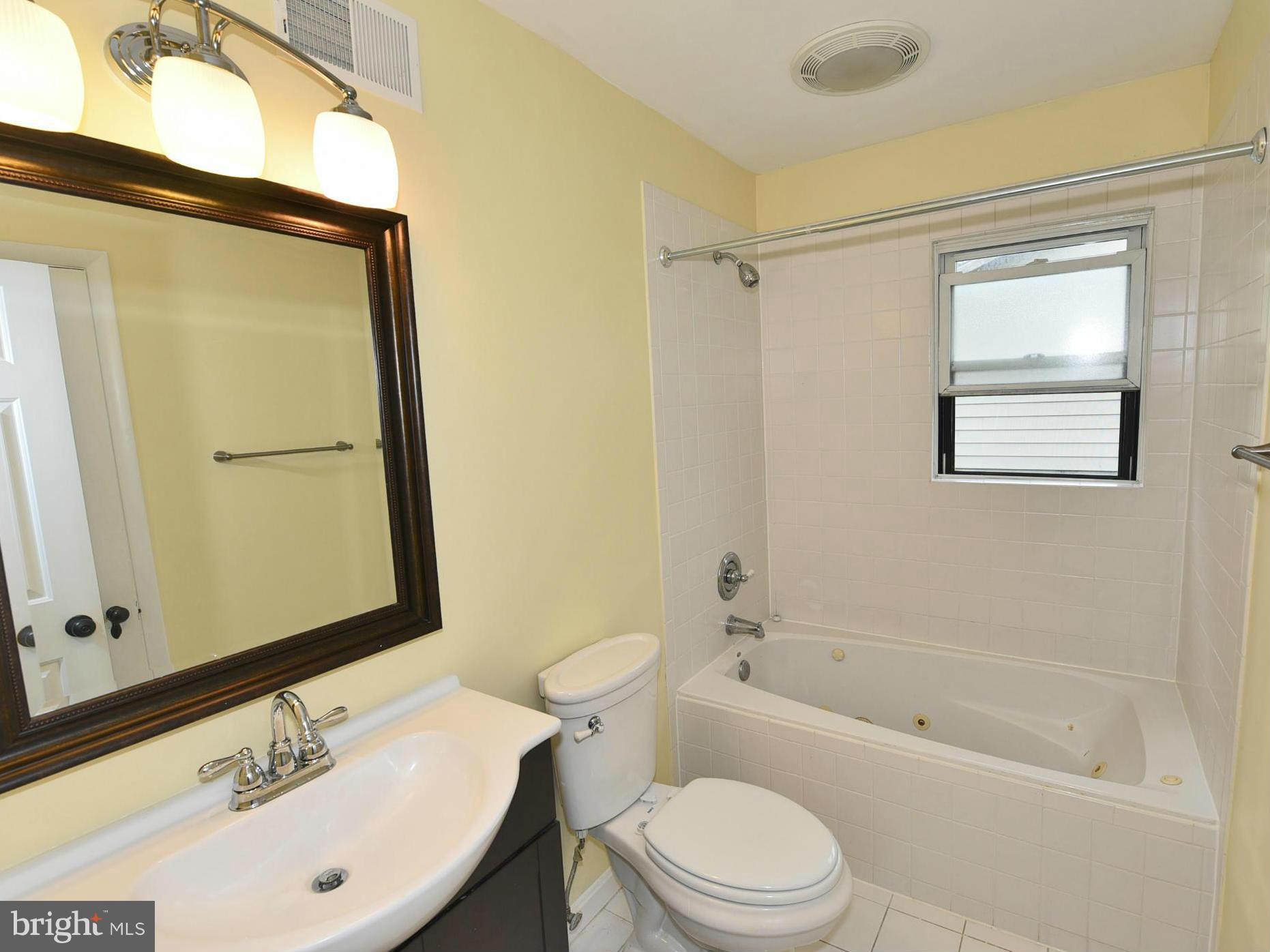 2138 Spencerville Road Spencerville, MD 20868 - Photo 9 of 30 a bathroom with a sink a toilet and shower