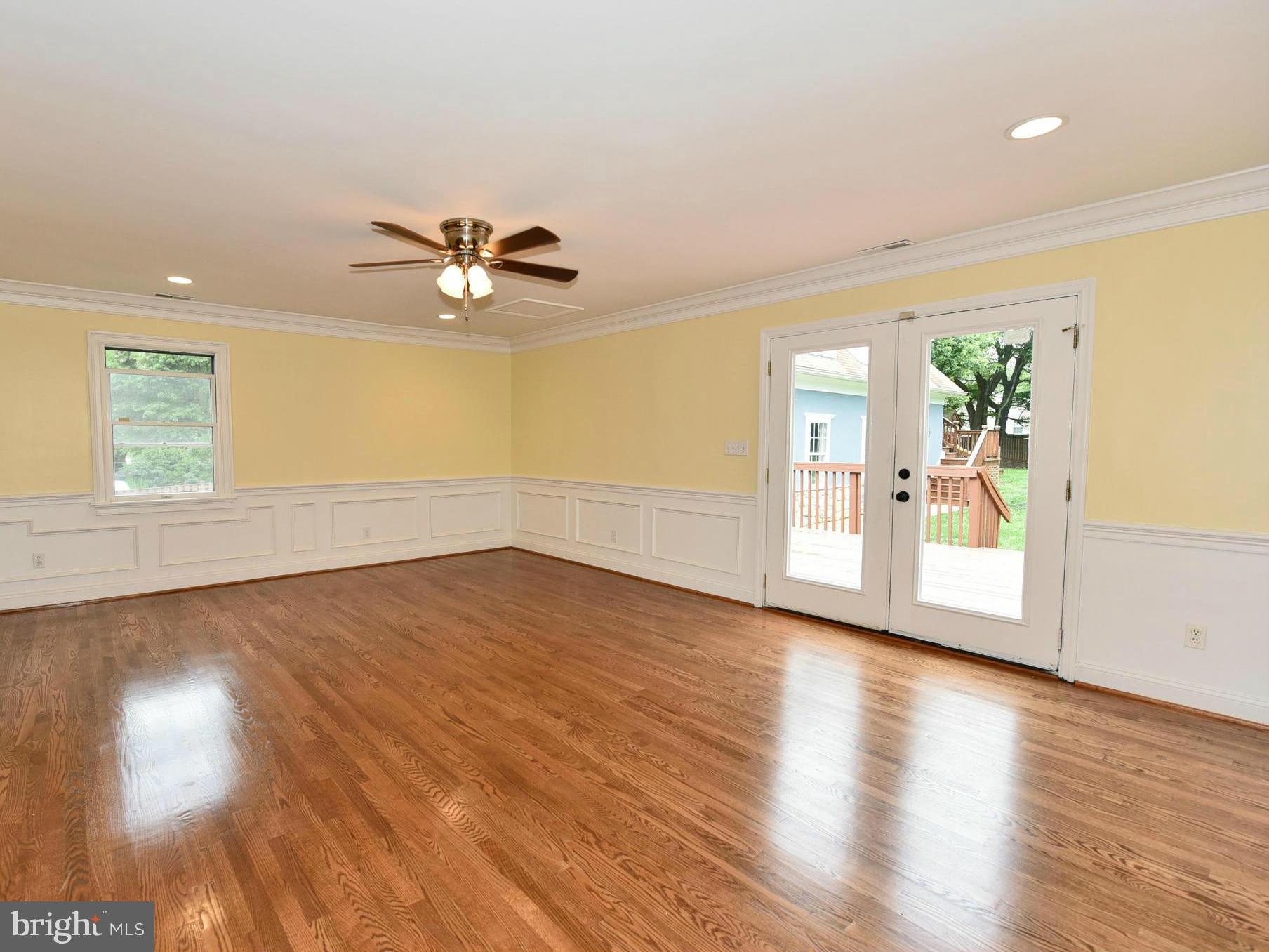 2138 Spencerville Road Spencerville, MD 20868 - Photo 10 of 30 a view of an empty room with window and wooden floor