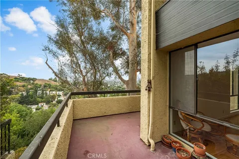a view of a balcony with ocean view