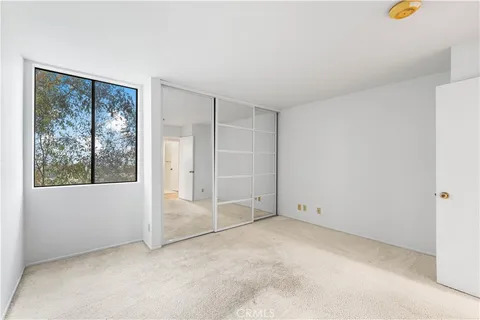 a view of a chairs and table in patio
