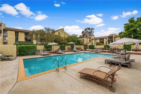 a view of a swimming pool with lounge chair