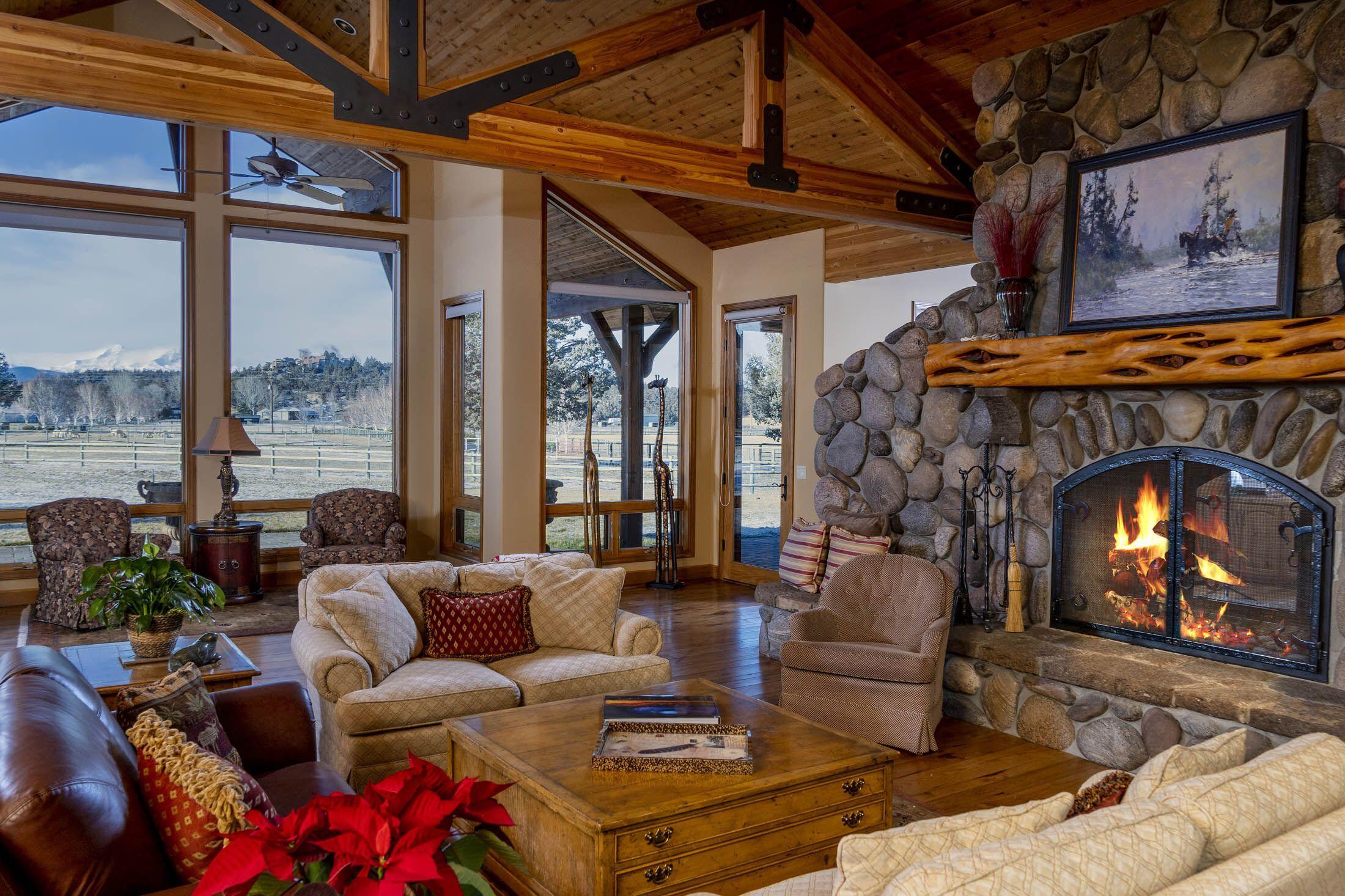 65520 Gerking Market Road Bend, OR 97703 - Photo 2 of 49 Cascade Mountain views from Great Room with vaulted ceilings, double sided wood burning fireplace, with gas starter, floor to ceiling river rock surround and Juniper mantle.