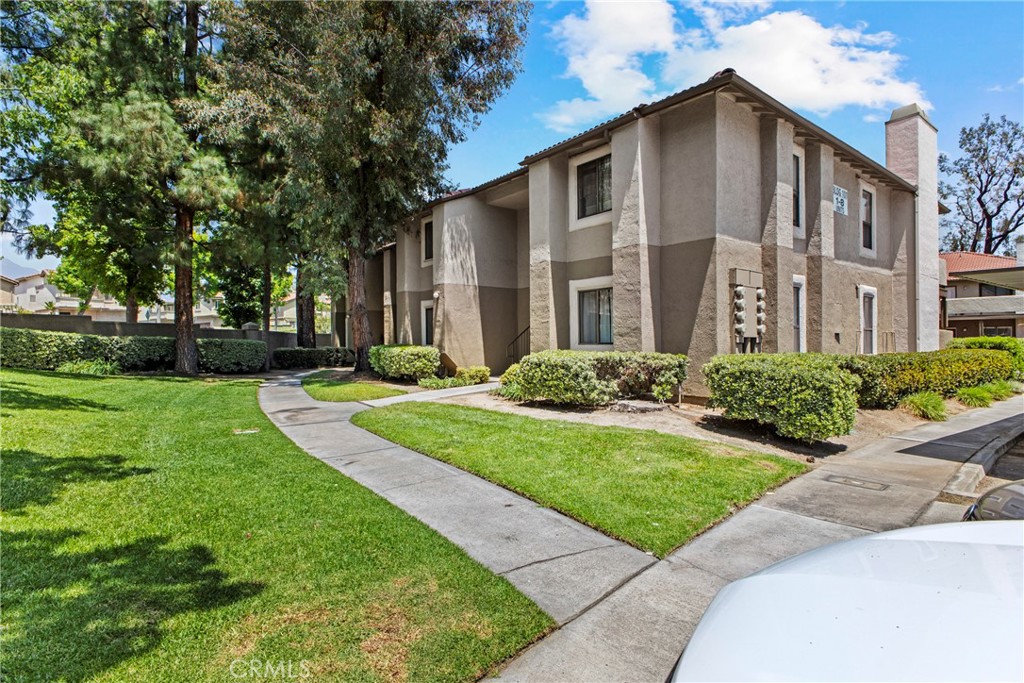10151 Arrow Route, Unit 6 Rancho Cucamonga, CA 91730 - Photo 2 of 24 a front view of a house with garden