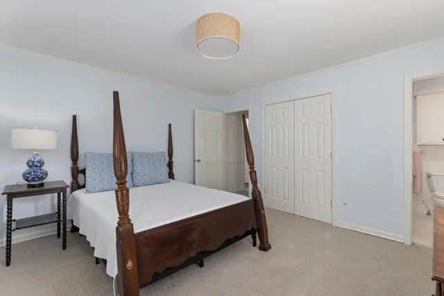 a bed room with a bed and a window