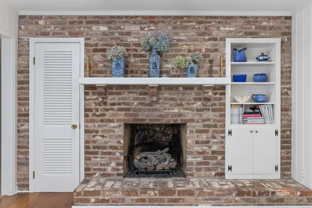 a stone house with a fireplace