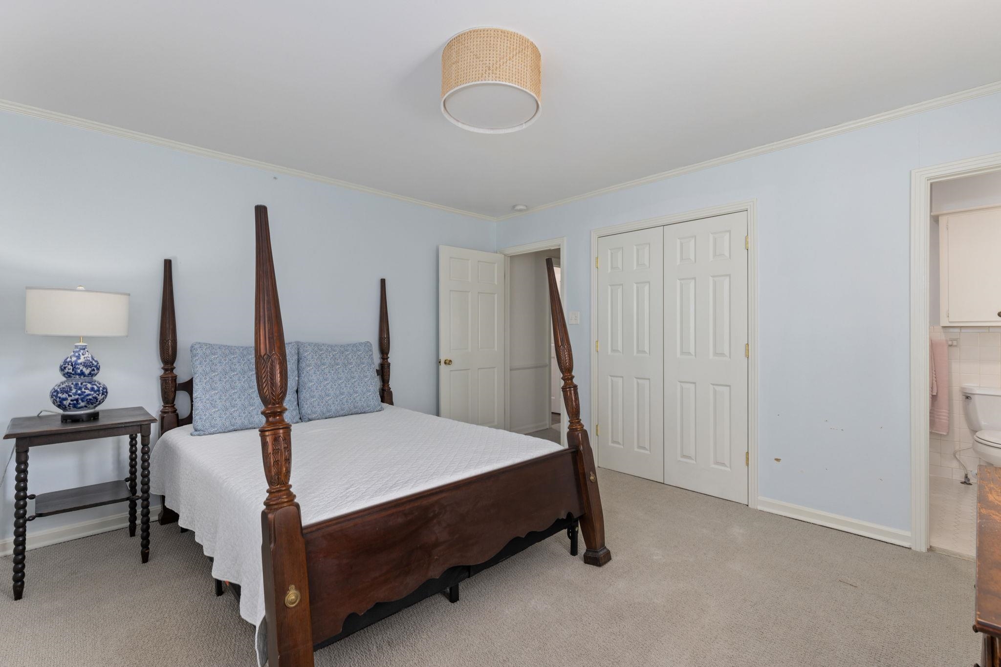1201 West Clover Lane Corinth, MS 38834 - Photo 8 of 35 Bedroom with ornamental molding, light carpet, and a closet