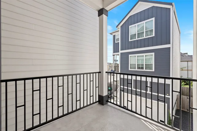 a view of a brick house with a balcony
