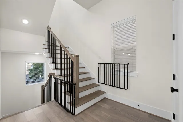 a view of entryway with stairs and wooden floor