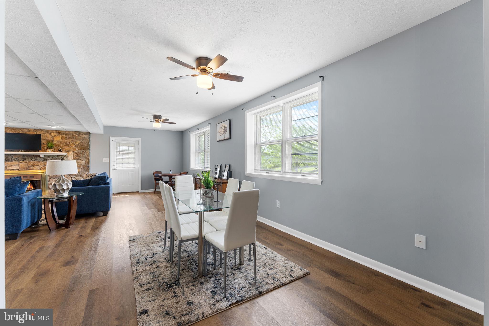 3296 Apple Pie Ridge Road Winchester, VA 22603 - Photo 35 of 61 a view of a dining room with furniture window and wooden floor