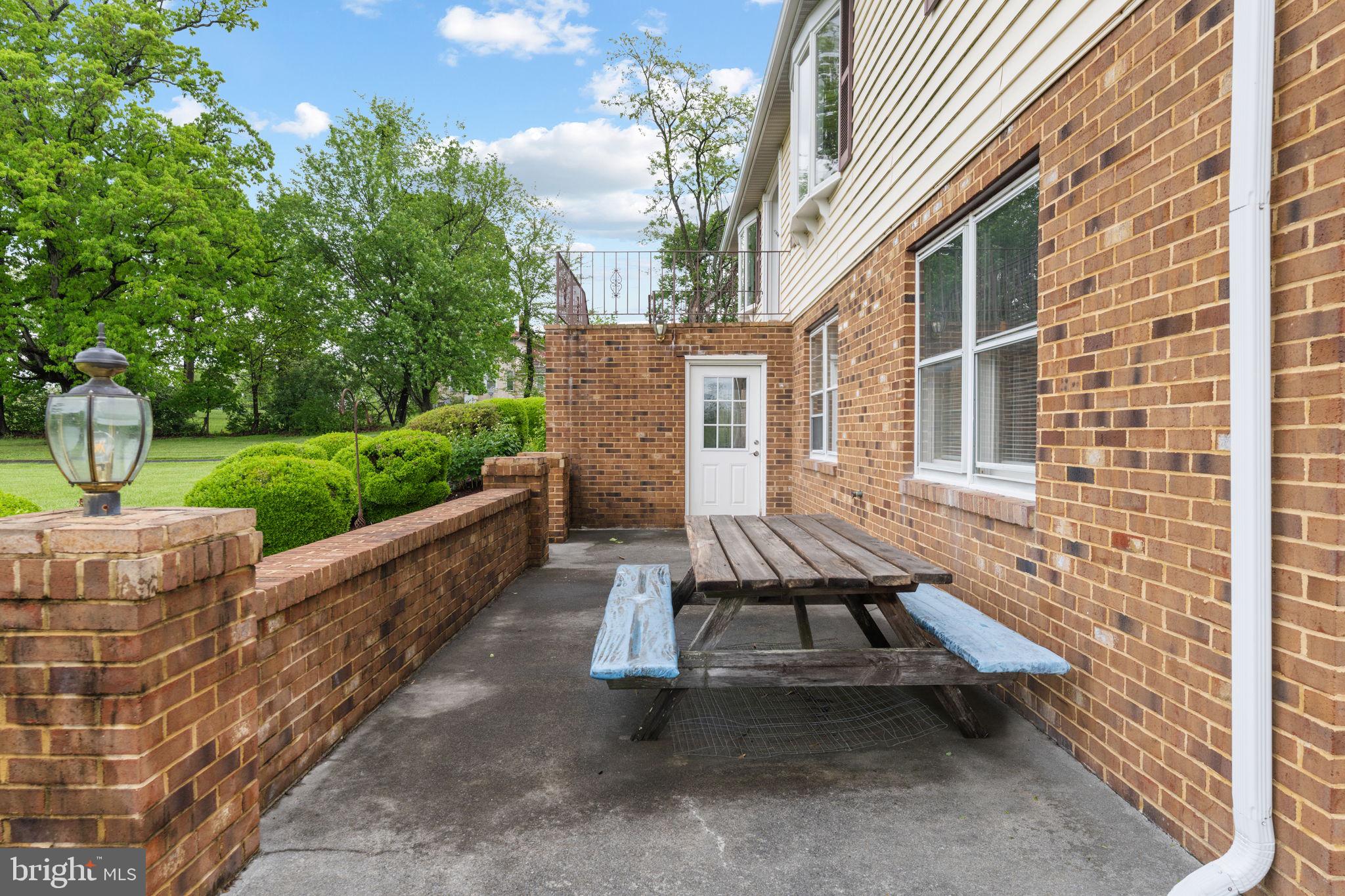 3296 Apple Pie Ridge Road Winchester, VA 22603 - Photo 51 of 61 a view of a patio with table and chairs and potted plants