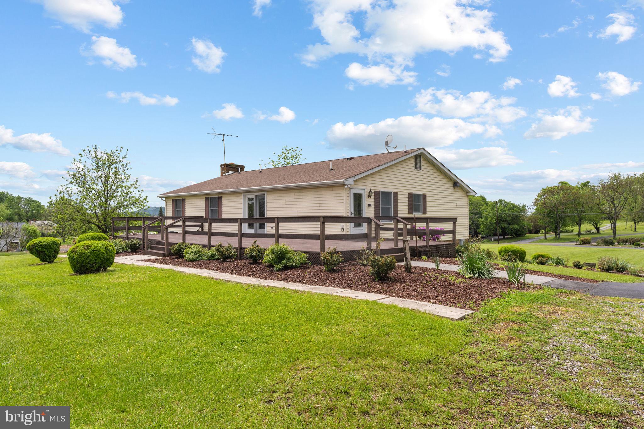 3296 Apple Pie Ridge Road Winchester, VA 22603 - Photo 53 of 61 a front view of house with yard and outdoor seating