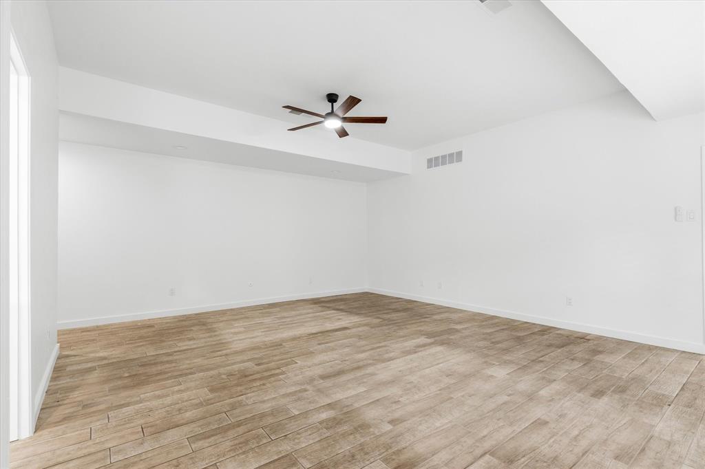 17003 Davenport Road Dallas, TX 75248 - Photo 21 of 40 wooden floor in a empty room
