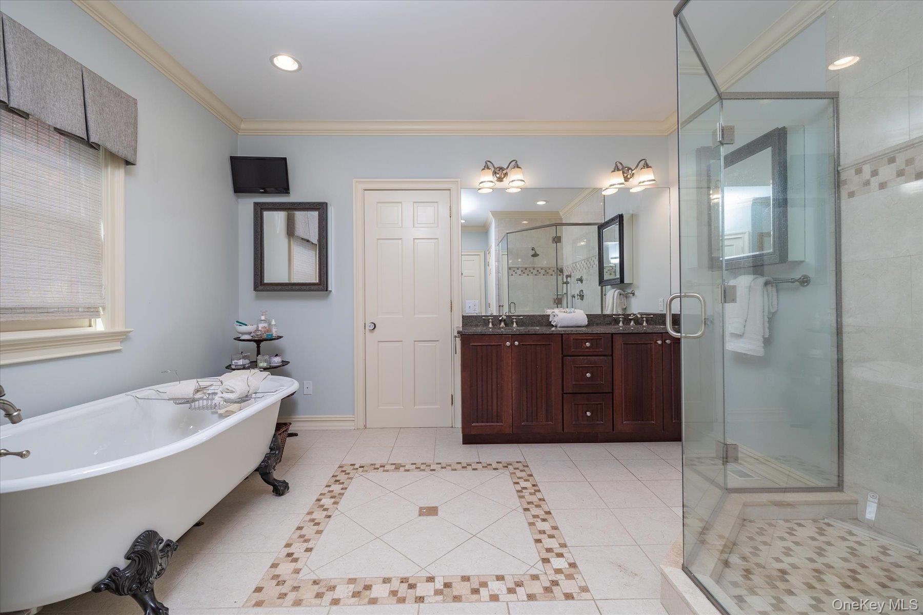 1750 Private Road, Unit 18 Mattituck, NY 11952 - Photo 25 of 49 a bathroom with a tub a sink shower and a mirror