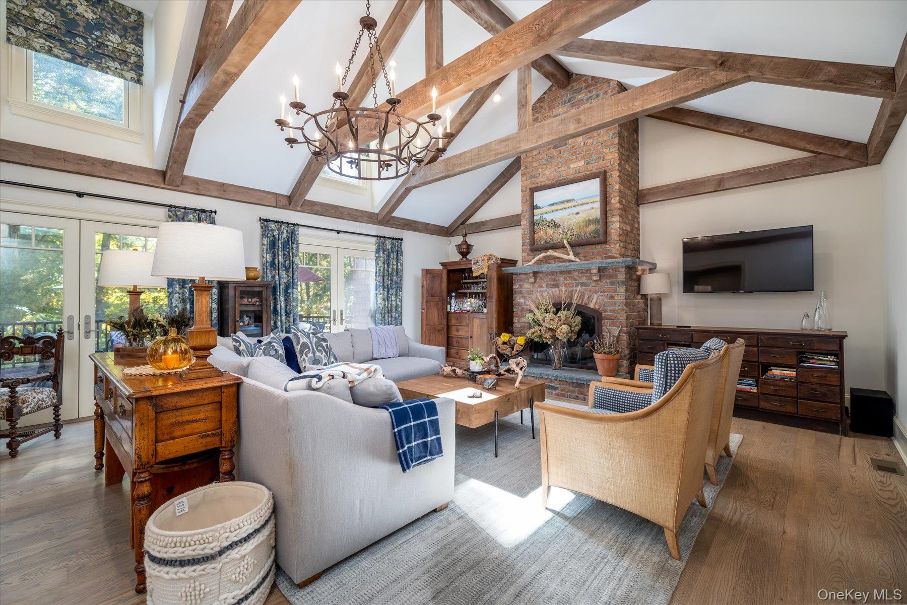 1750 Private Road, Unit 18 Mattituck, NY 11952 - Photo 26 of 49 a living room with fireplace furniture and a flat screen tv