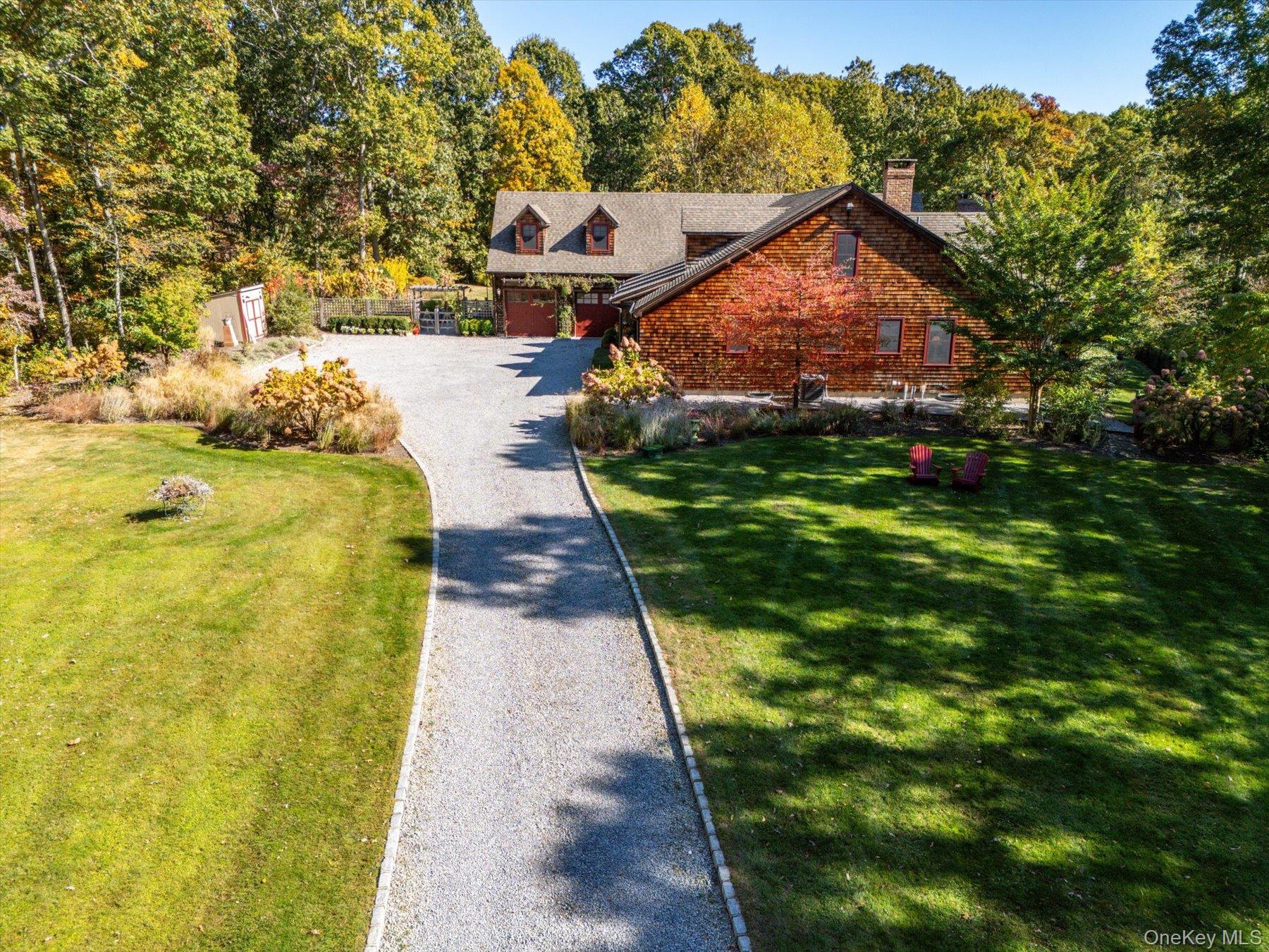 1750 Private Road, Unit 18 Mattituck, NY 11952 - Photo 3 of 49 a view of a pathway with a yard
