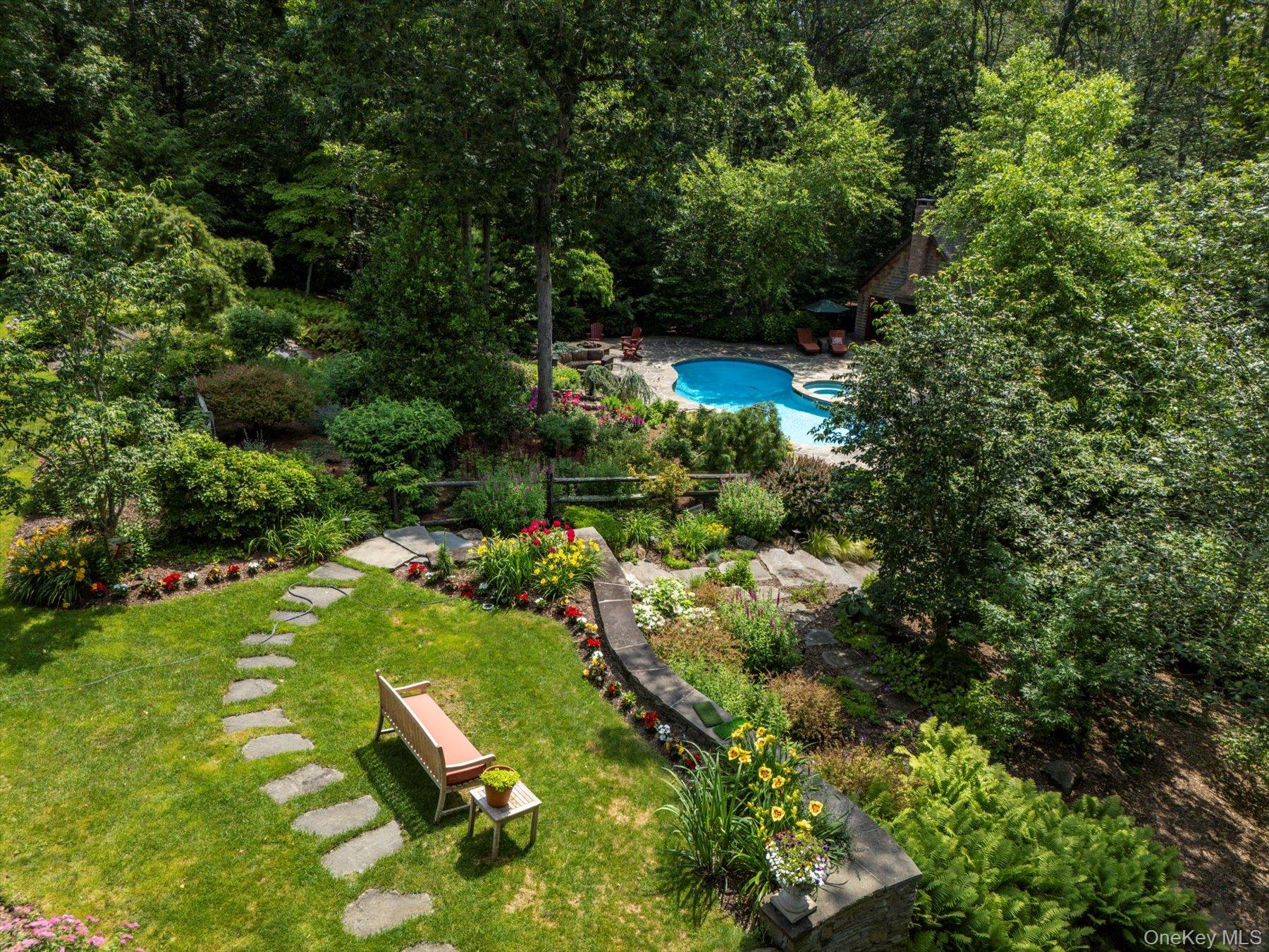 1750 Private Road, Unit 18 Mattituck, NY 11952 - Photo 32 of 49 a backyard of a house with a yard and outdoor seating