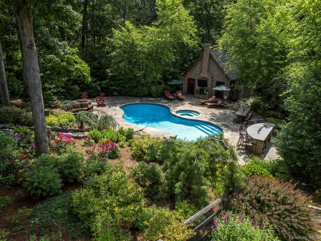 a bedroom with furniture and large windows